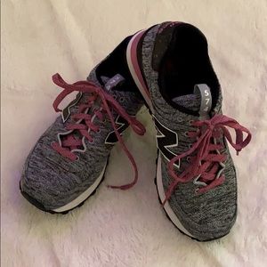 Size 8.5 New Balance 574 athletic shoes.